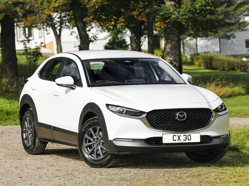 White Mazda CX-30 from the front sitting side on 